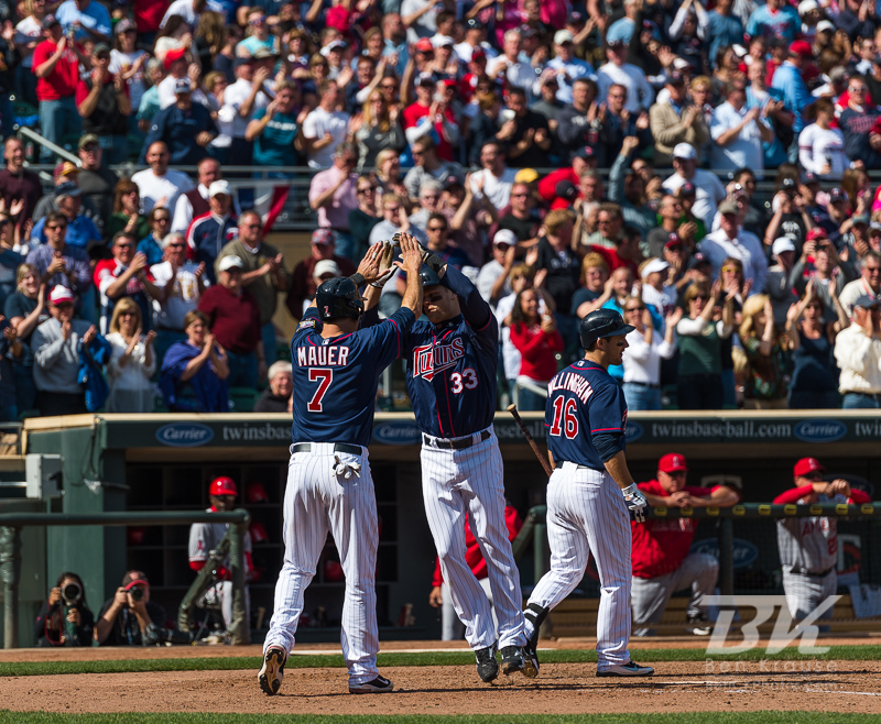 Minnesota Twins DH Justin Morneau celebrates with Joe Mauer after hitting a go-ahead home run, his 1st of the year, in the 8th inning against the Los Angeles Angels at Target Field in Minneapolis, MInnesota on April 12, 2012.  The Twins defeated the Angels 10 to 9.  Photo: © Ben Krause 2012