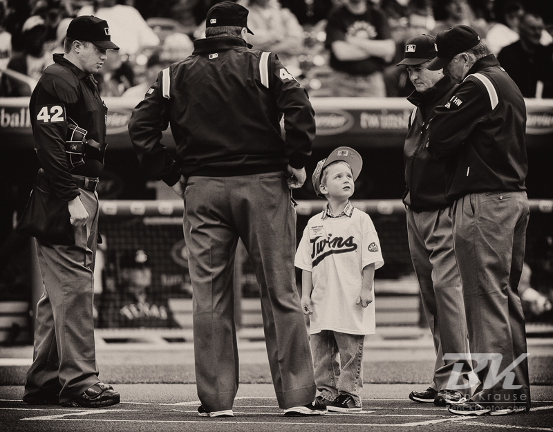 A young fan waits at home plate prior to the singing of the national anthem before a game between the Minnesota Twins and the Texas Rangers on Jackie Robinson Day at Target Field in Minneapolis, Minnesota on April 15, 2012.  The Rangers defeated the Twins 4 to 3.  Photo: © Ben Krause 2012