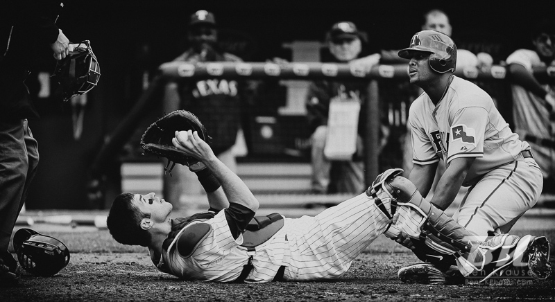 Minnesota Twins catcher Joe Mauer waits for the home plate umpire's call after tagging out Texas Rangers 3rd baseman Adrian Beltre on Jackie Robinson Day at Target Field in Minneapolis, Minnesota on April 15, 2012.  The Rangers defeated the Twins 4 to 3.  Photo: © Ben Krause 2012