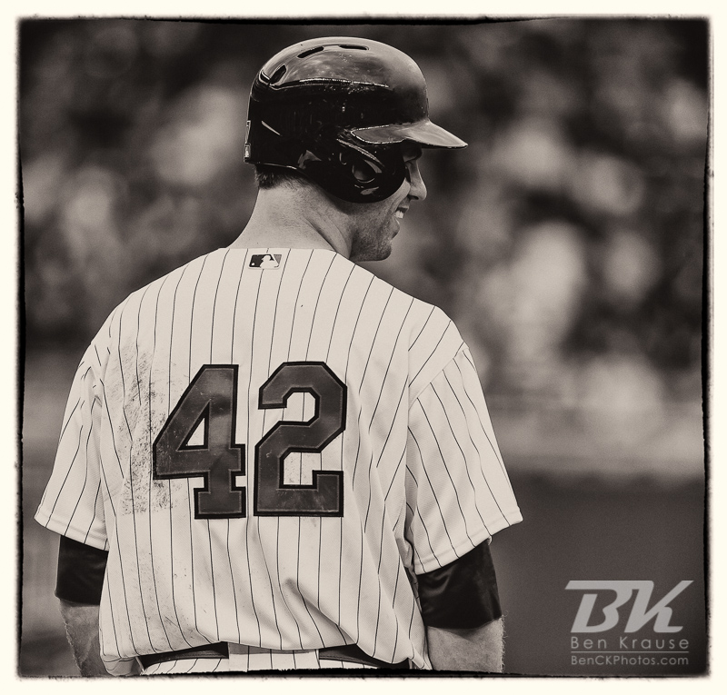 Minnesota Twins catcher Joe Mauer smiles while talking to the 1st base umpire during a game against the Texas Rangers on Jackie Robinson Day at Target Field in Minneapolis, Minnesota on April 15, 2012.  The Rangers defeated the Twins 4 to 3.  Photo: © Ben Krause 2012