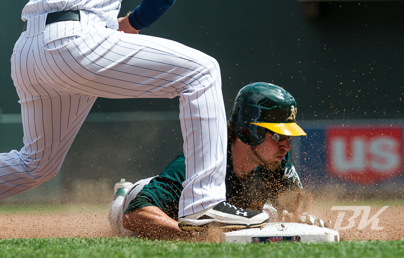 Oakland Athletics right fielder Josh Reddick slides in safely at 3rd base with a triple during a game against the Minnesota Twins on May 28, 2012 at Target Field in Minneapolis, Minnesota.  The Twins defeated the Athletics 5 to 4.  Photo: © Ben Krause 2012