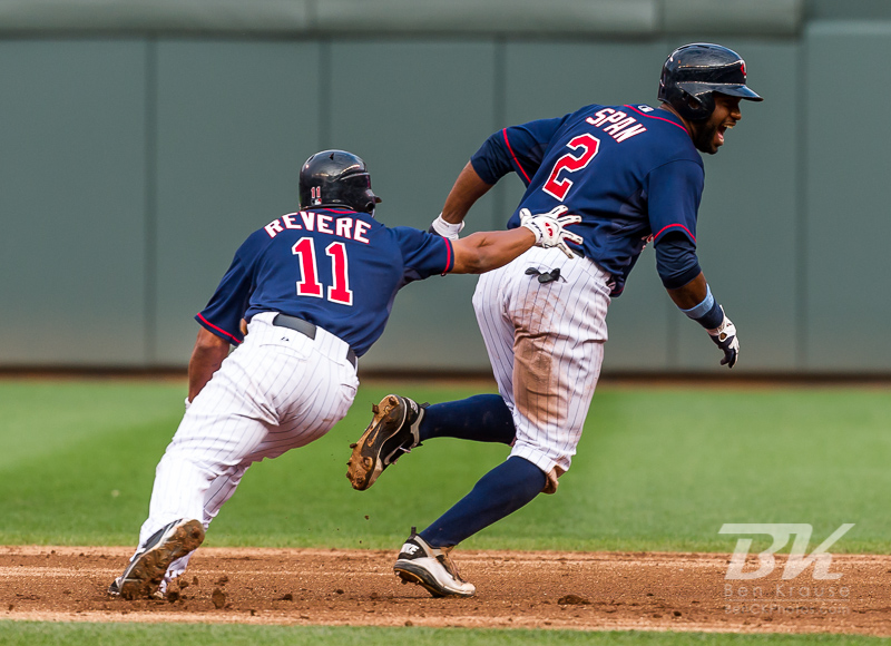 Minnesota Twins center fielder Denard Span eludes his teammates while celebrating a walk off victory against the Milwaukee Brewers in the 15th inning at Target Field in Minneapolis, Minnesota on June 17, 2012.  The Twins defeated the Brewers 5 to 4.  The game was the longest in Target Field history.  Photo: © Ben Krause 2012