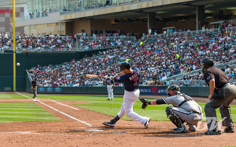 Joe Mauer #7 of the Minnesota Twins connects for a double during a game against the Chicago White Sox on September 16, 2012 at Target Field in Minneapolis, Minnesota.  The White Sox defeated the Twins 9 to 2.  Photo: © Ben Krause 2012